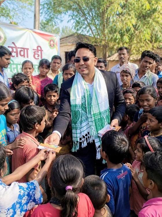 Distribution of supplies to children during a village outreach programme.